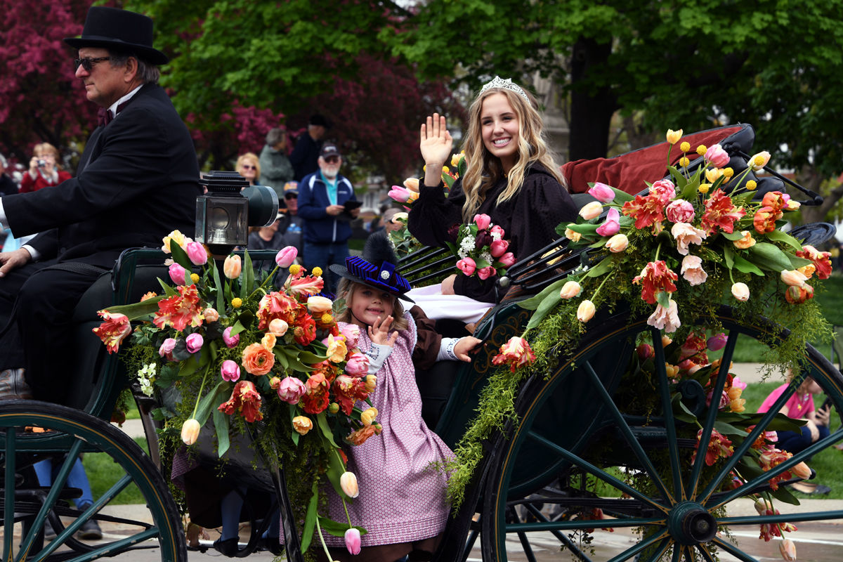 240 Queen Olivia and her flower girls in a horse drawn carriage.JPG